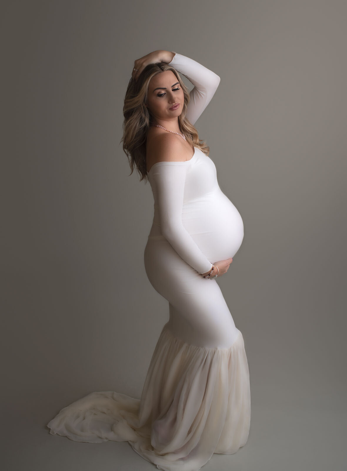 pregnant mom in white mermaid dress