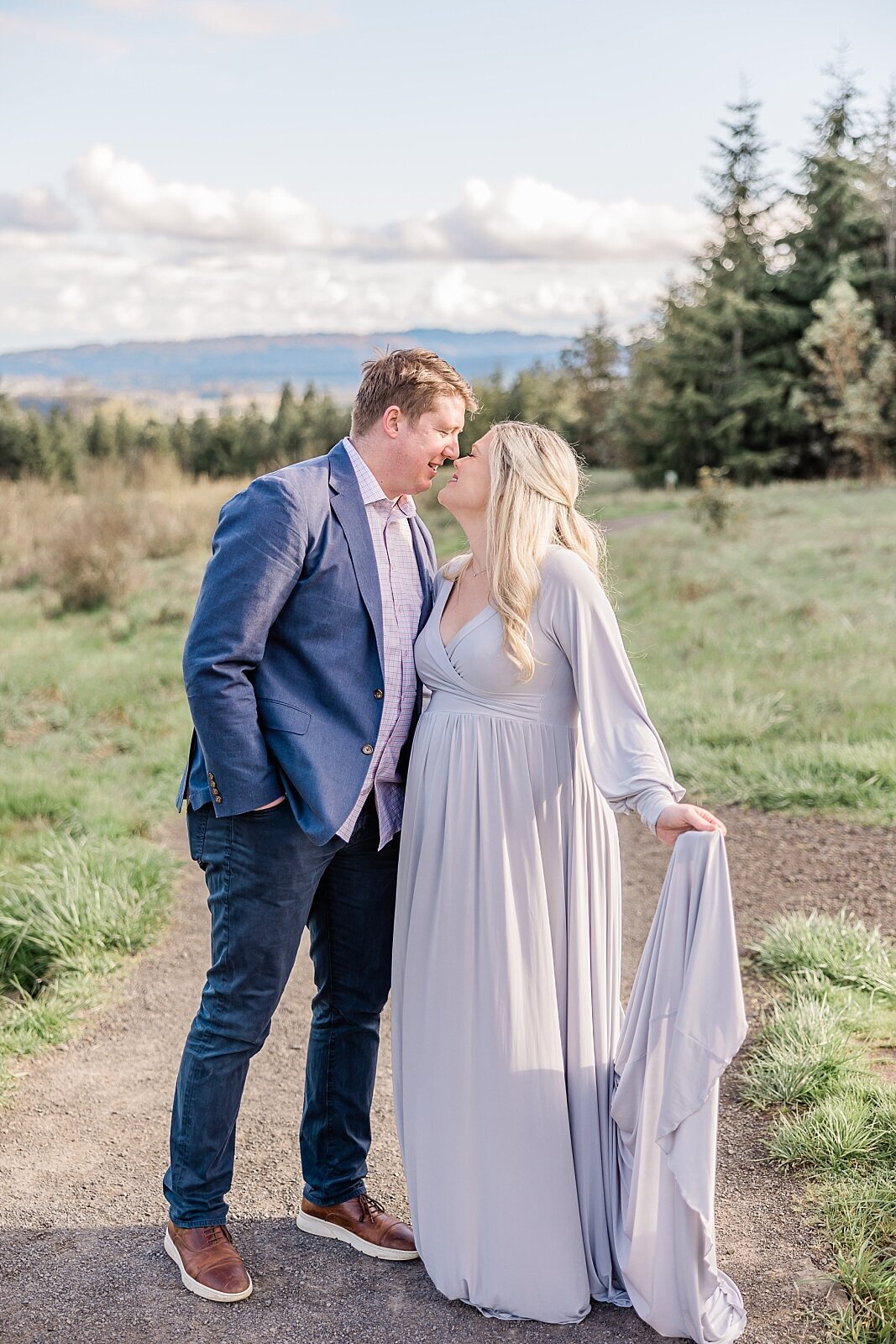 husband and wife looking into each other's eyes in portland maternity session