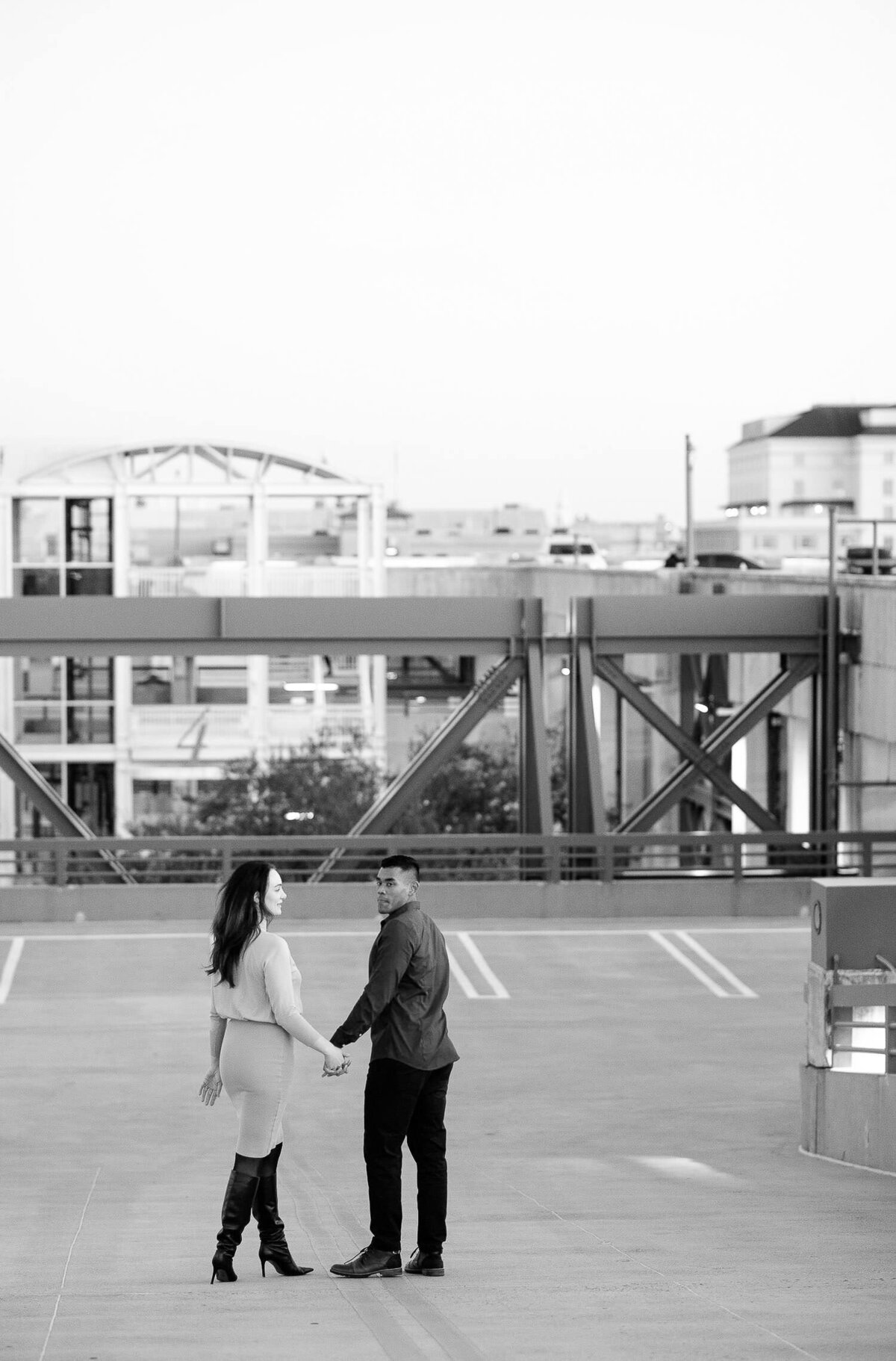 Couple on top of parking garage in Charleston for engagement session