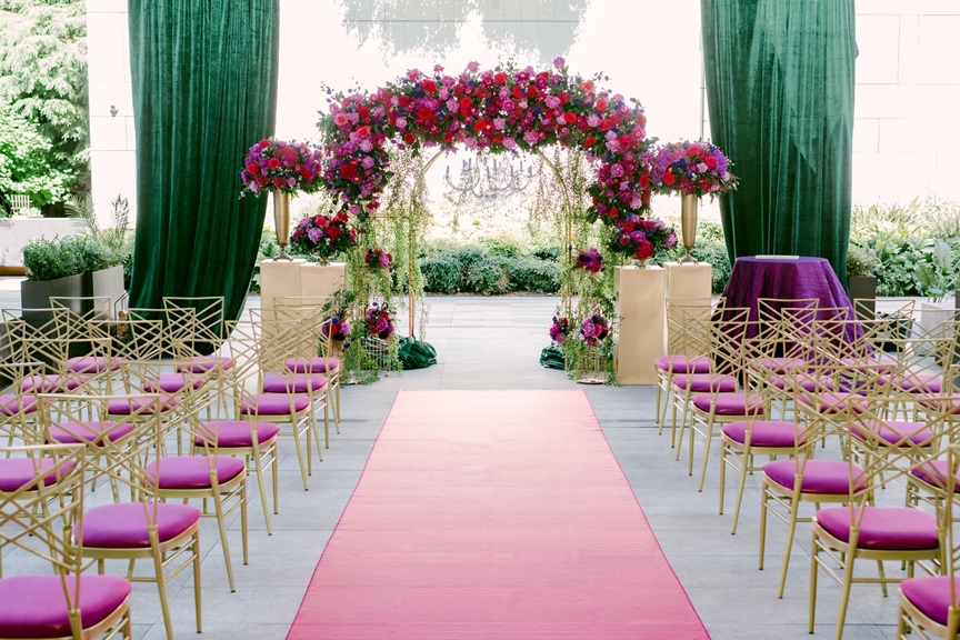 secret-garden-wedding-purple-pink-red-greenery-arch-chandelier-draping-chairs