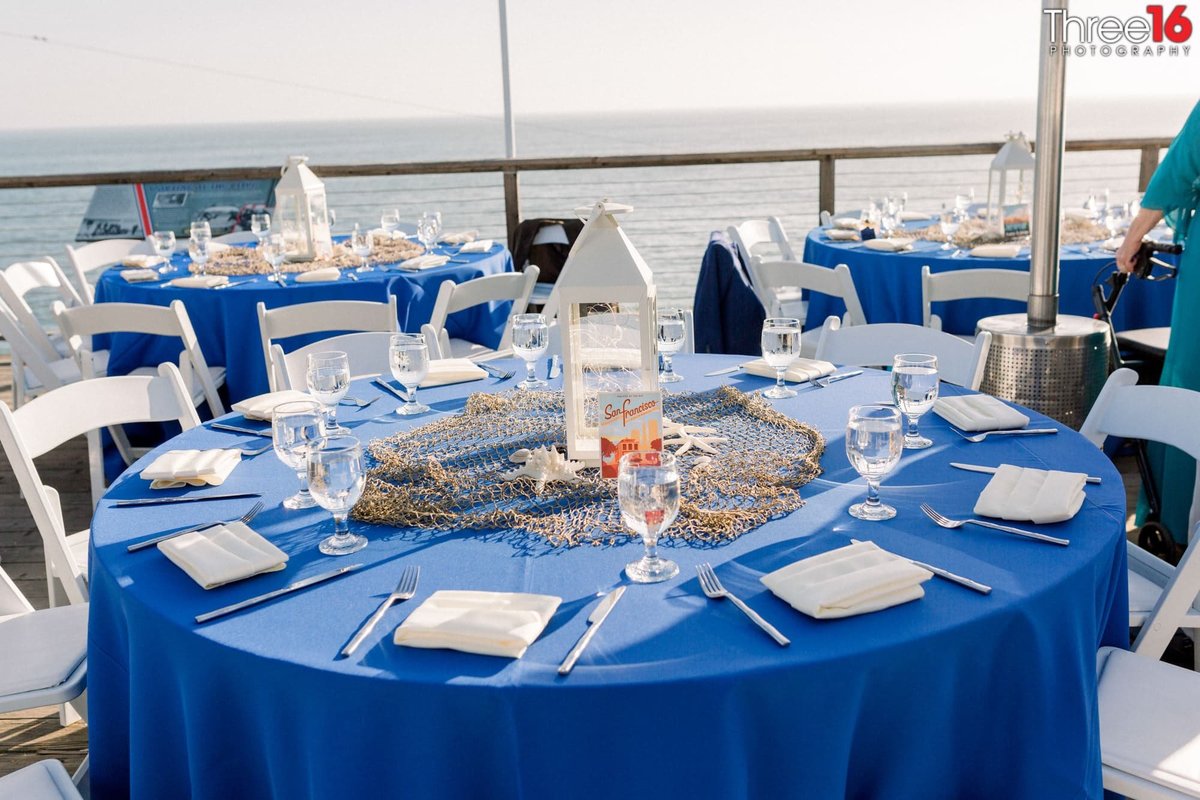 Table setup at a Crystal Cove State Beach Wedding Reception