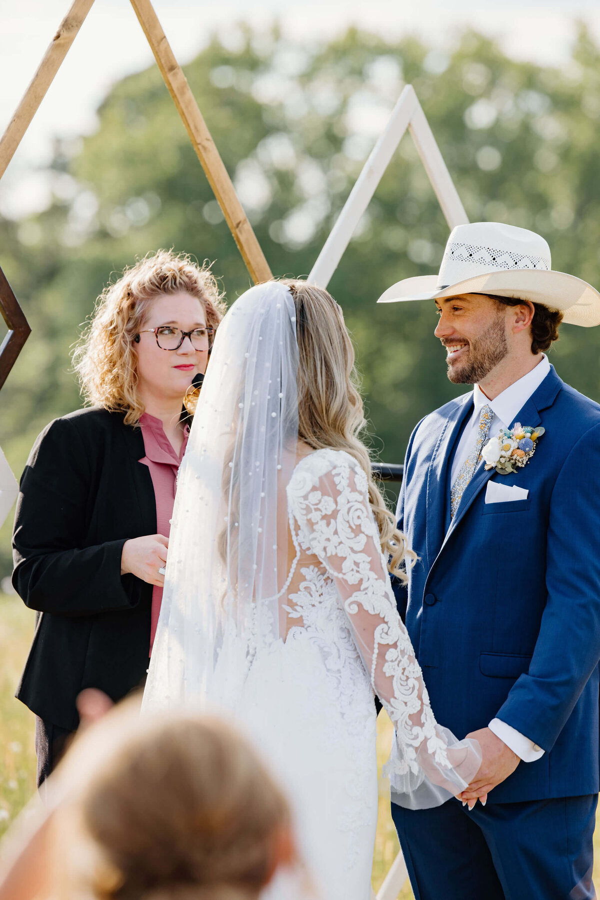 Bride and groom exchanging vows during spring wedding day ceremony