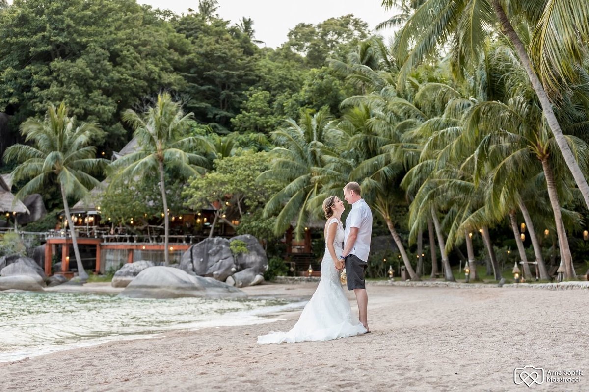 Bride and Groom kissing on beach on Koh Tao