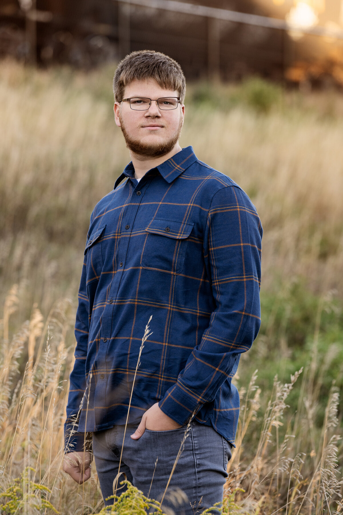 Orono Minnesota high school senior  picture of boy in long grasses