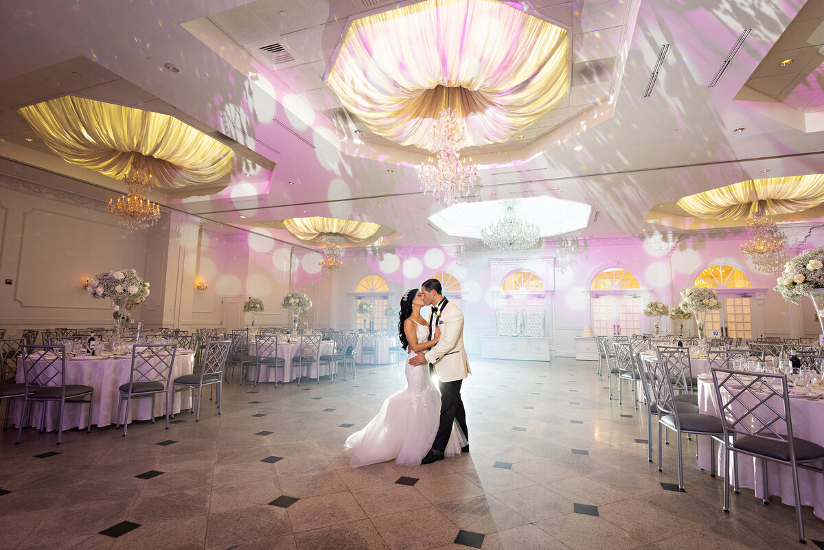 bride-groom-kissing-reception-addison-park-nj