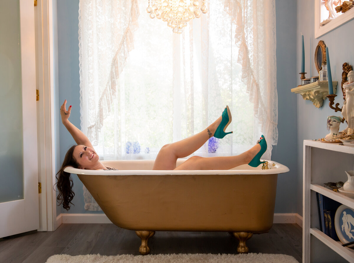 goddess studio boudoir teal heels bathtub window lace curtains chandelier