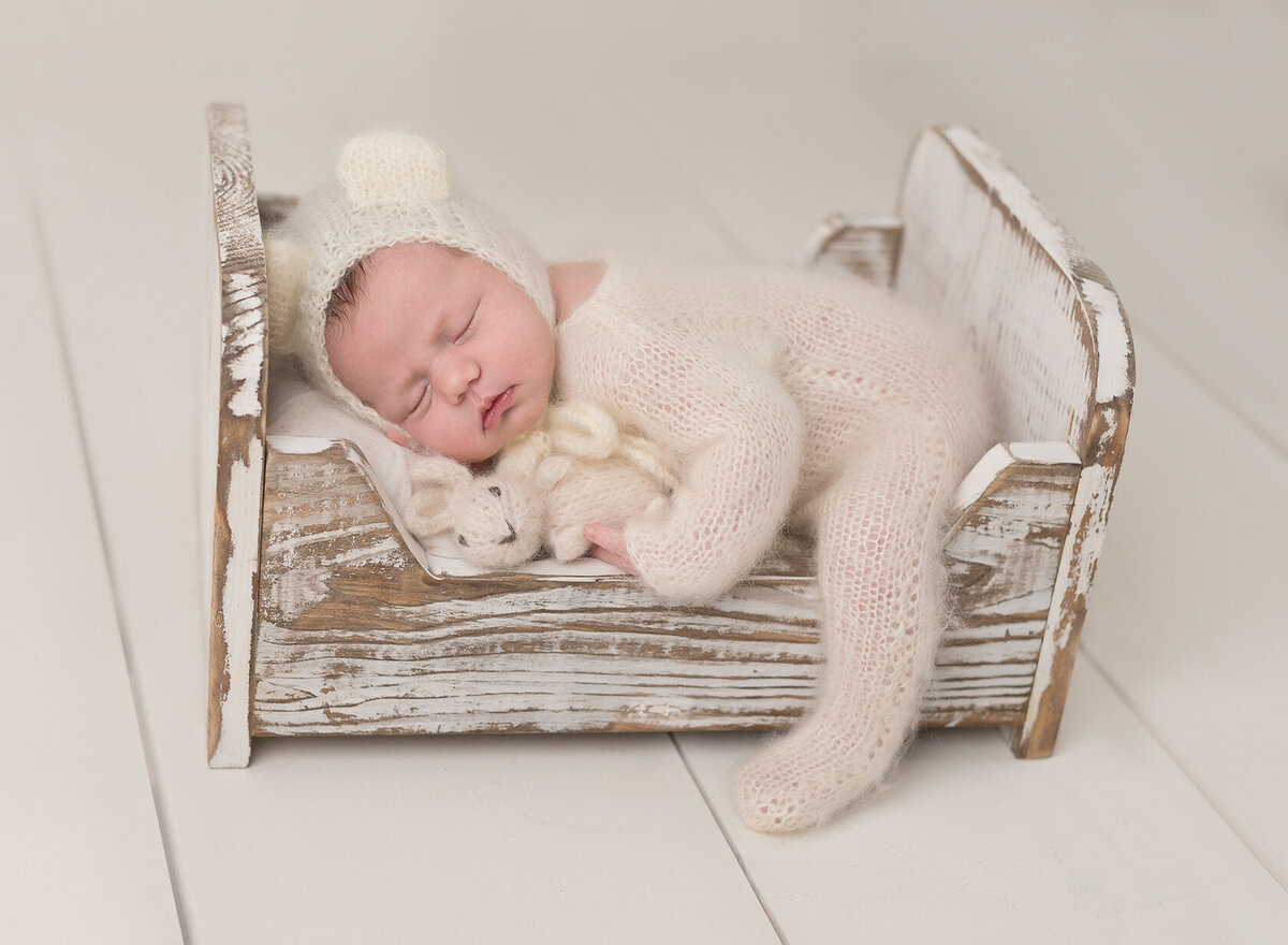 Sleeping little baby in a cute cozy bed, by Laura King, Houston Photographer