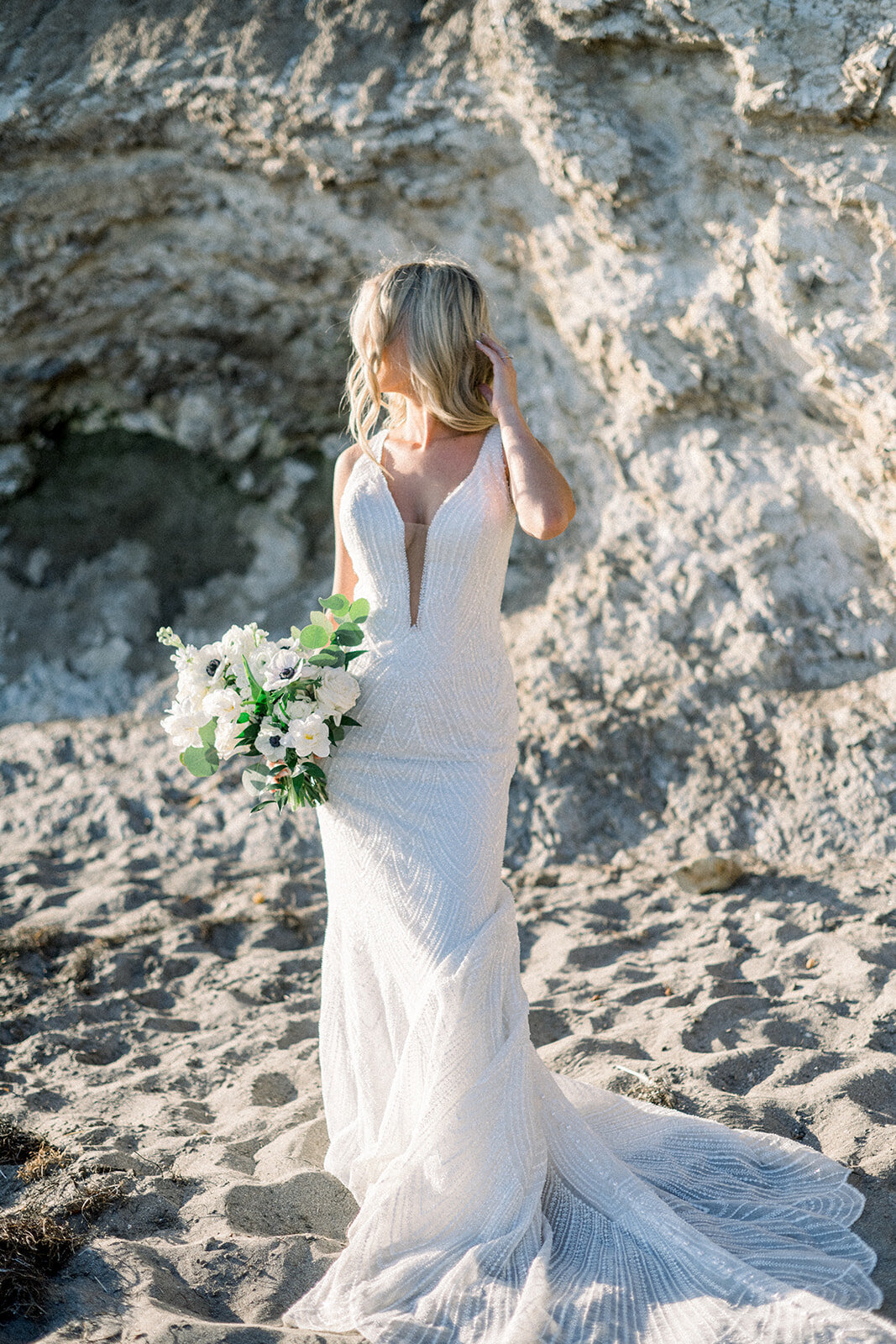 Bride on the beach at Dolphin Bay Resort in Pismo Beach, CA