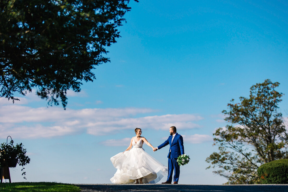 Groom twirling his bride at Dulany's Overlook wedding