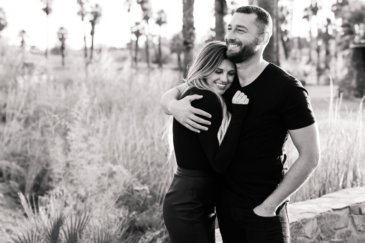 couple embracing each other in black and white photo