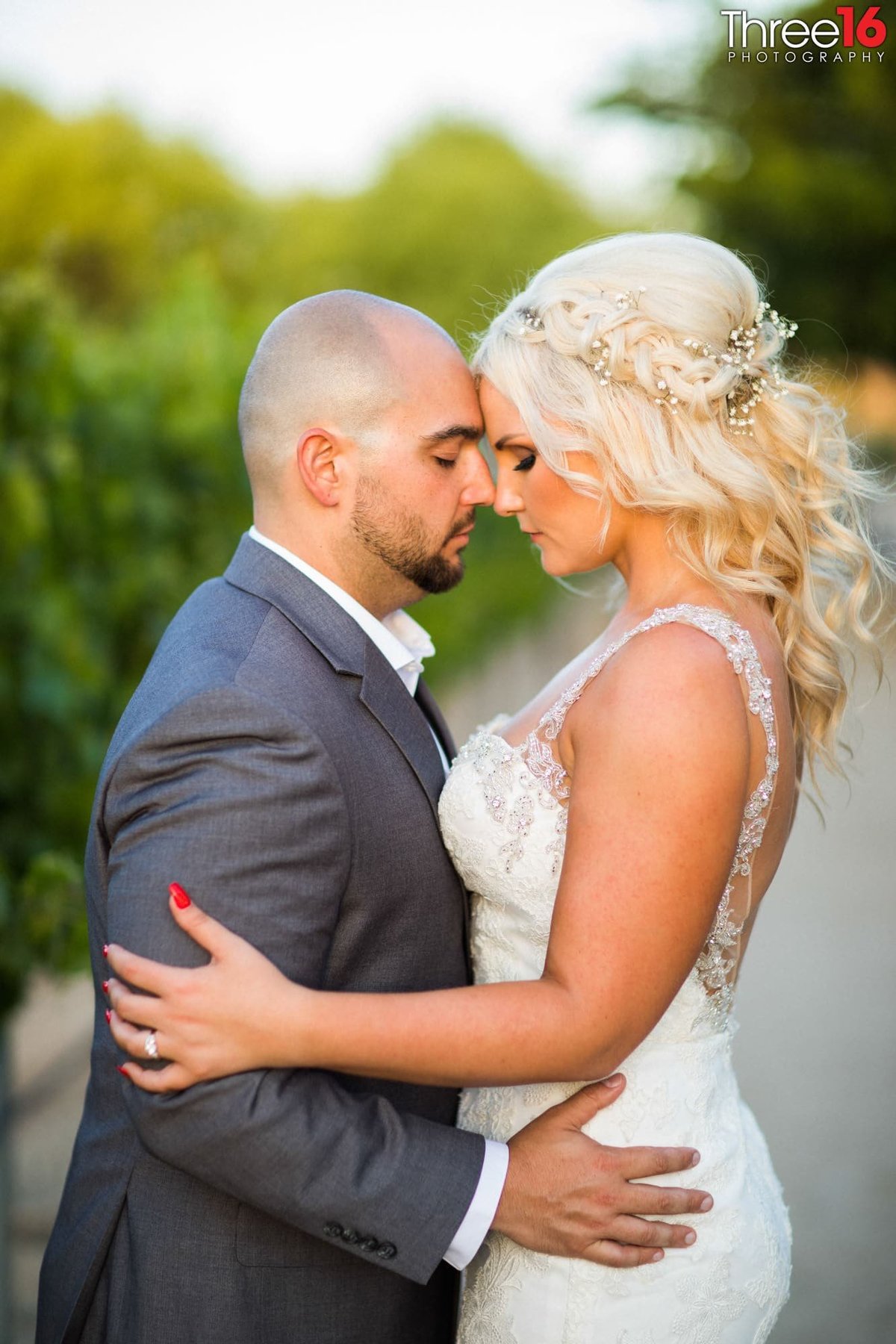 Bride and Groom hold each other during a tender moment in prayer