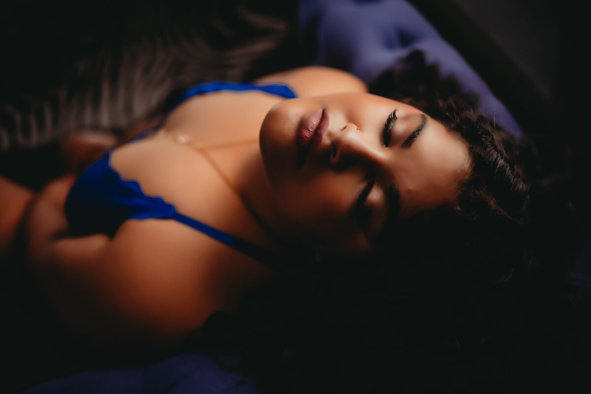 woman in blue lingerie on blue couch