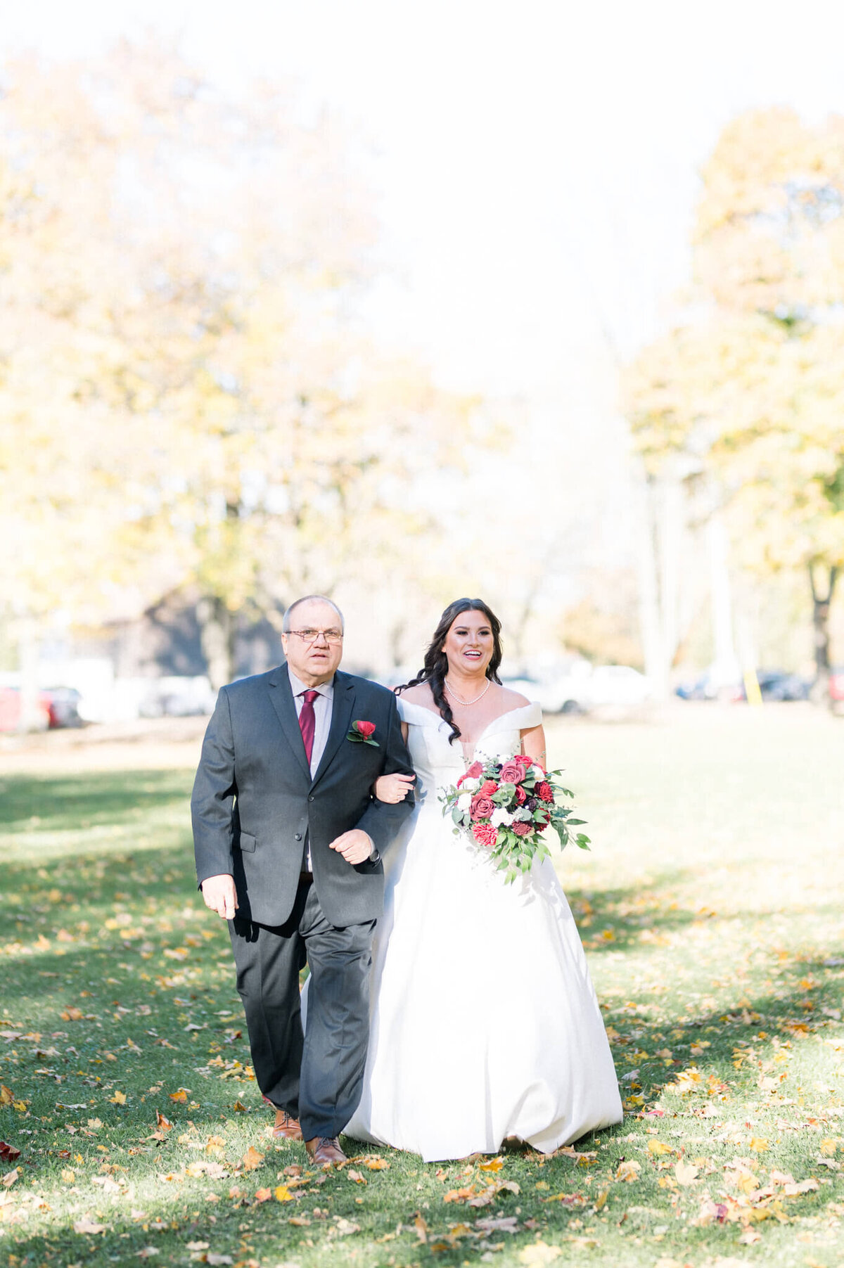 Bride walking with her father down the aisle at her Toronto wedding