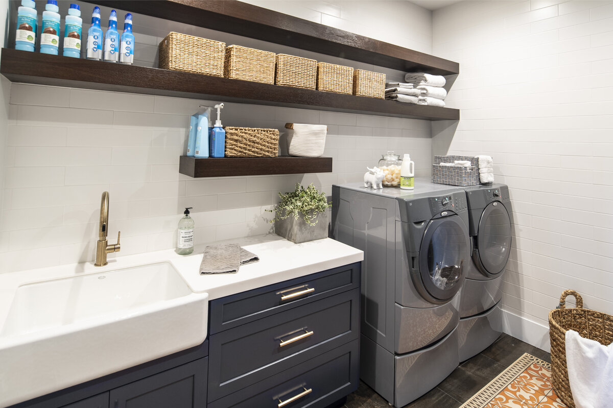 Organized Laundry Area with Blue Drawers and Brown Wall Rack