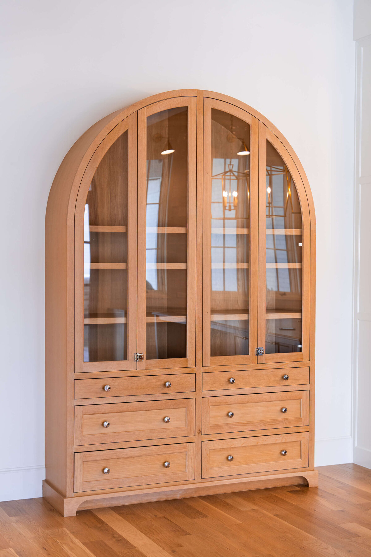 Custom arched cabinet in Colleyville custom home