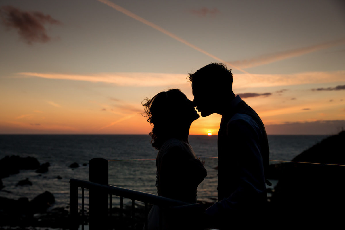 Sunset on the roof terrace with wedding couple at Tunnels Beaches