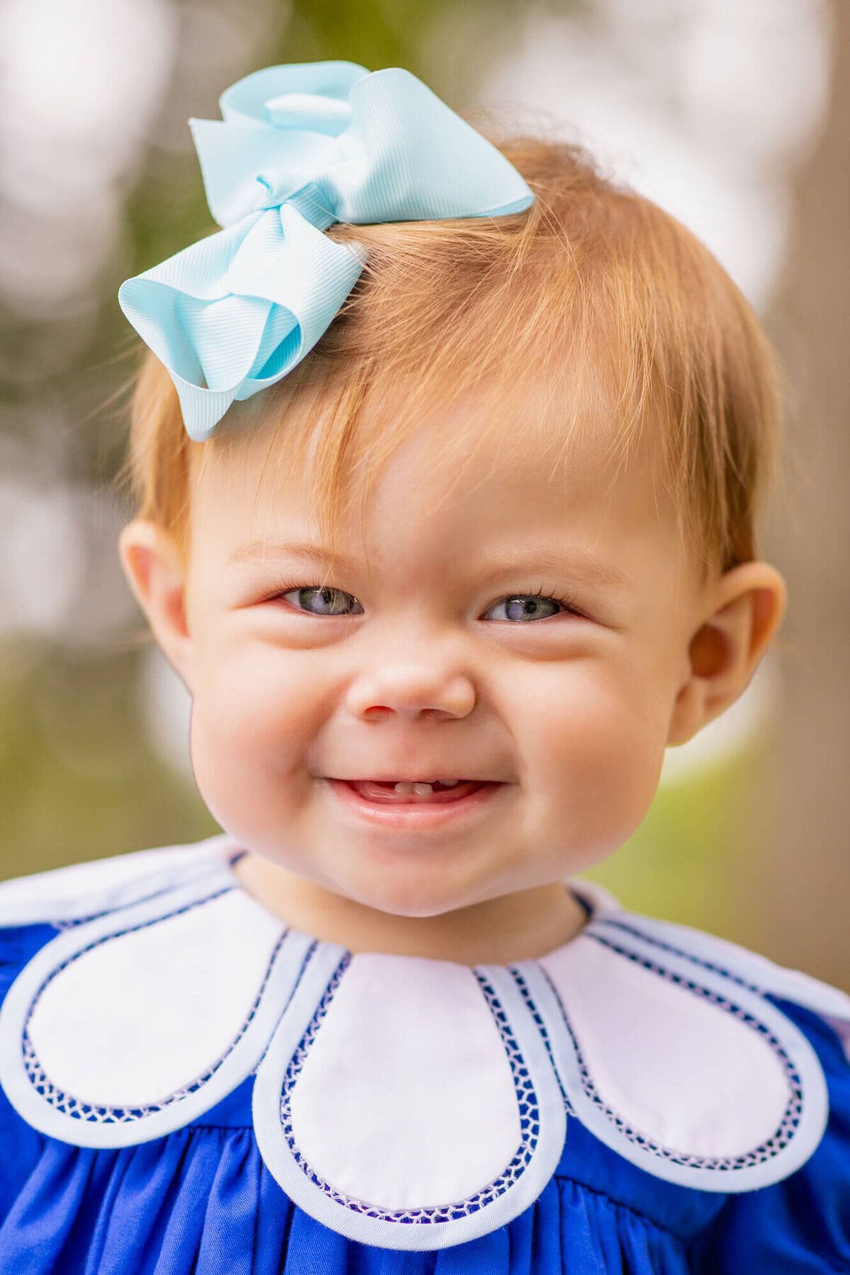 little girl with bright blue eyes  smiling