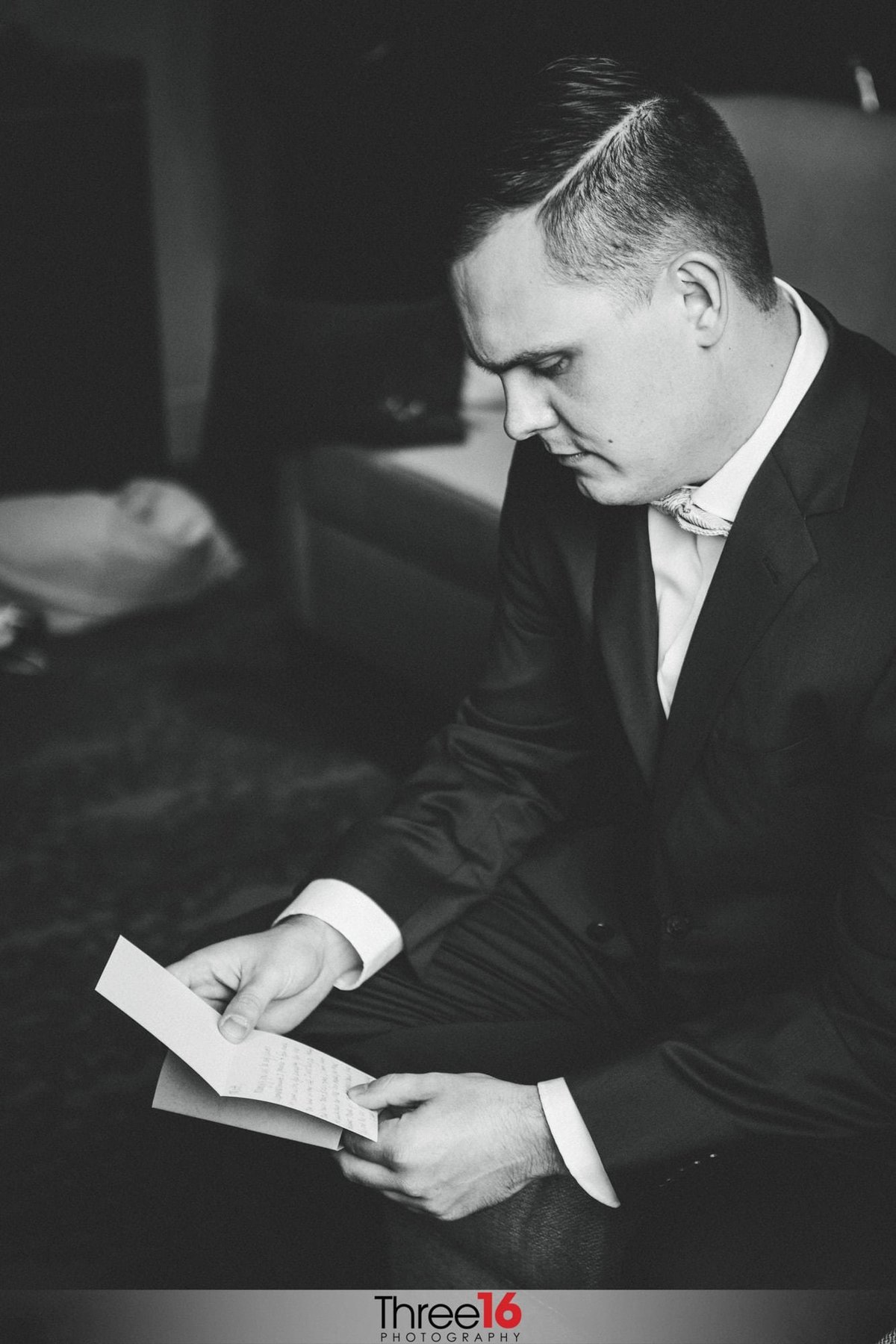 Groom reads a note he received from his Bride