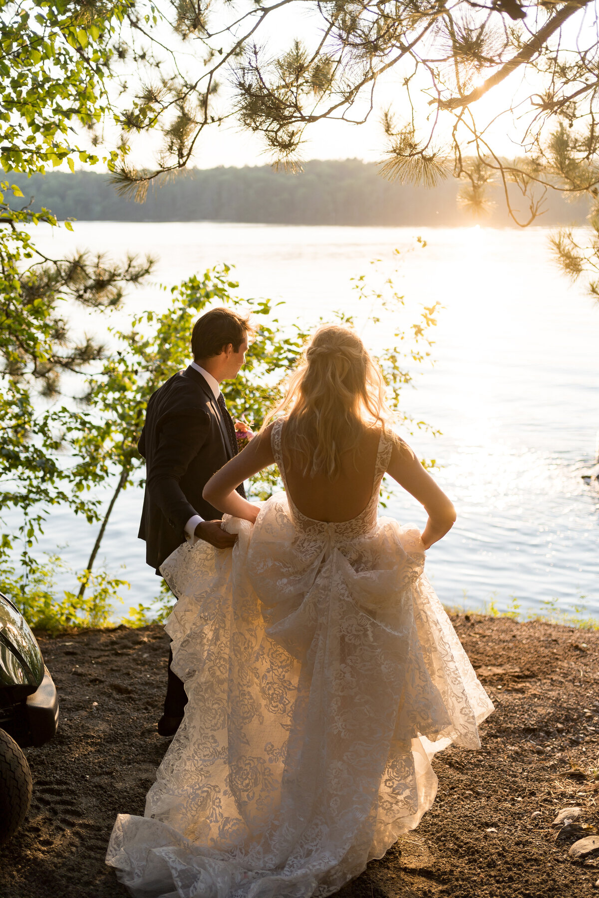 sunset on the lake with a wedding couple