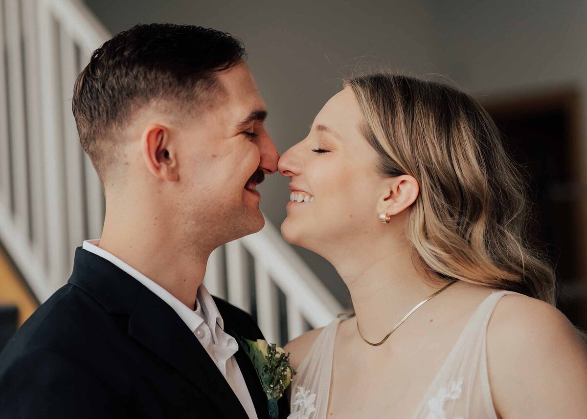 Maddie Rae Photography up close image of bride and groom giving eskimo kisses