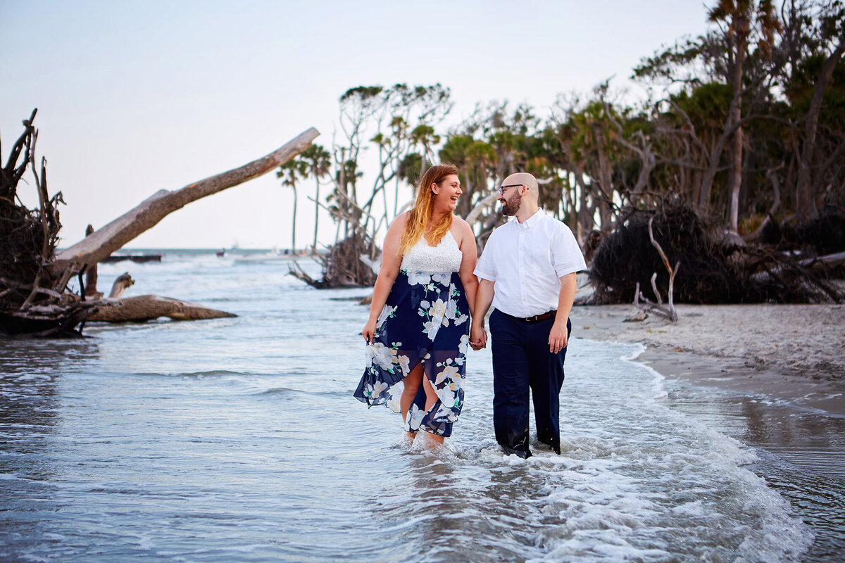 Couple walking on beach at Hunting Island State Park Engagement Session Charleston Wedding Photographer