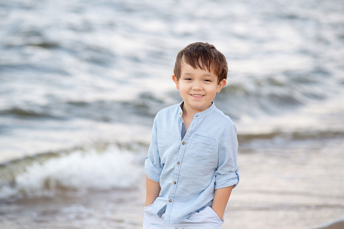 Family session of little boy at the beach