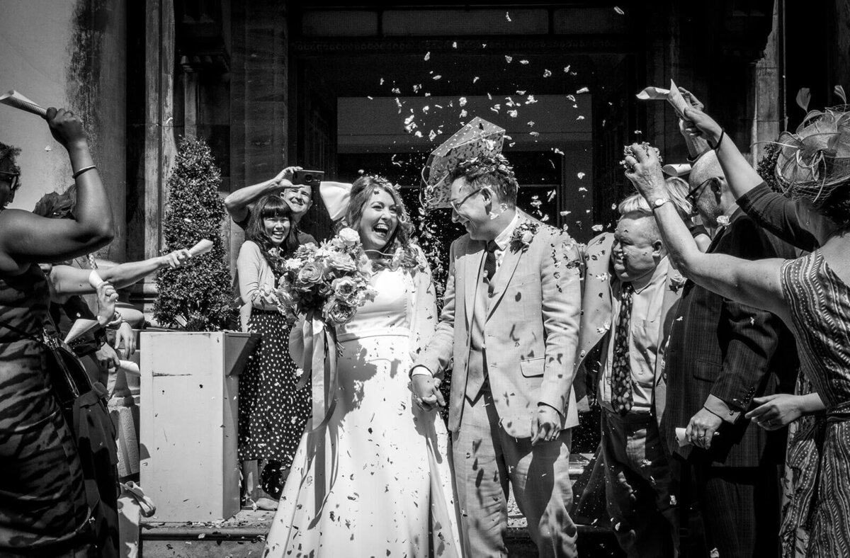 Confetti exit from Stoke Newington Town Hall .  Image in black and white