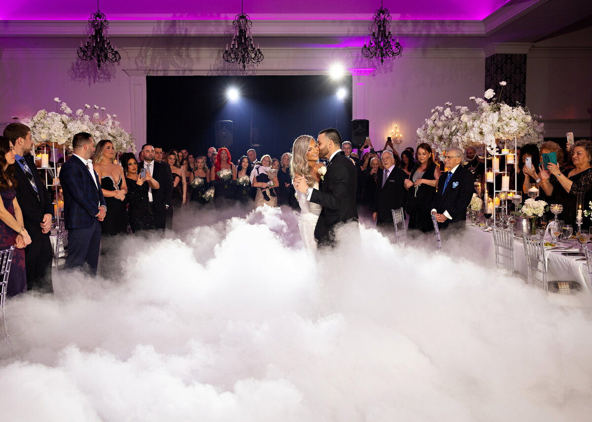 bride-groom-kissing-reception-smoke-machine-nj