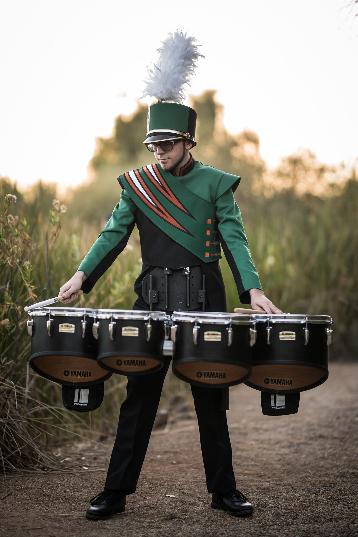 High School Senior in band uniform with drum set