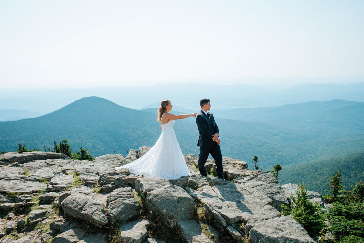 first look on summit of killington mountain in vermont adventure wedding