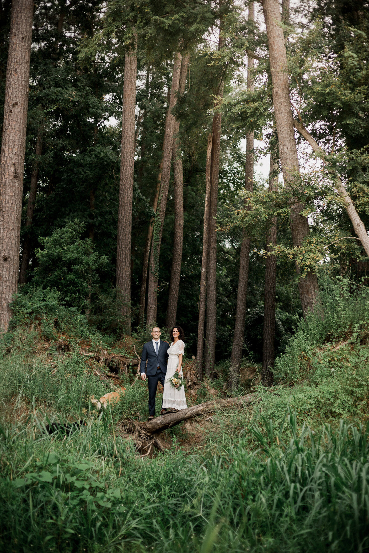 couple hiking in the forest during elopement