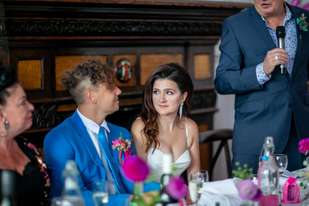 Bride glances to groom during emotional speech