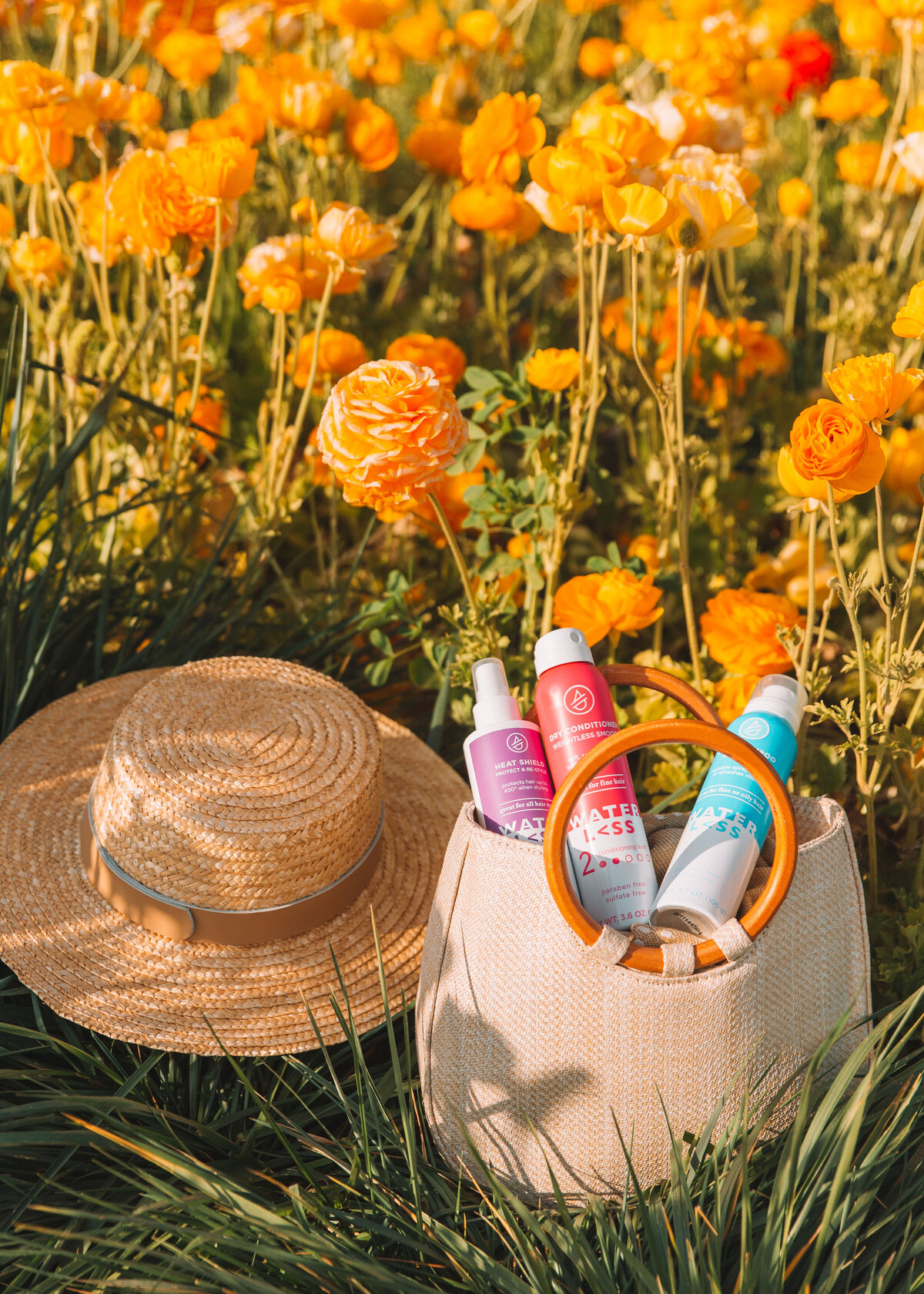 Styled product imagery in a flower field for a haircare brand