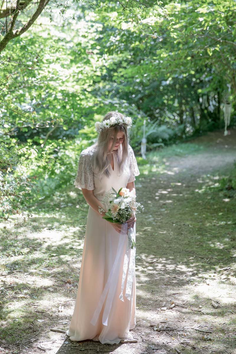 Bride in the woods at The Green Weddings in Cornwall