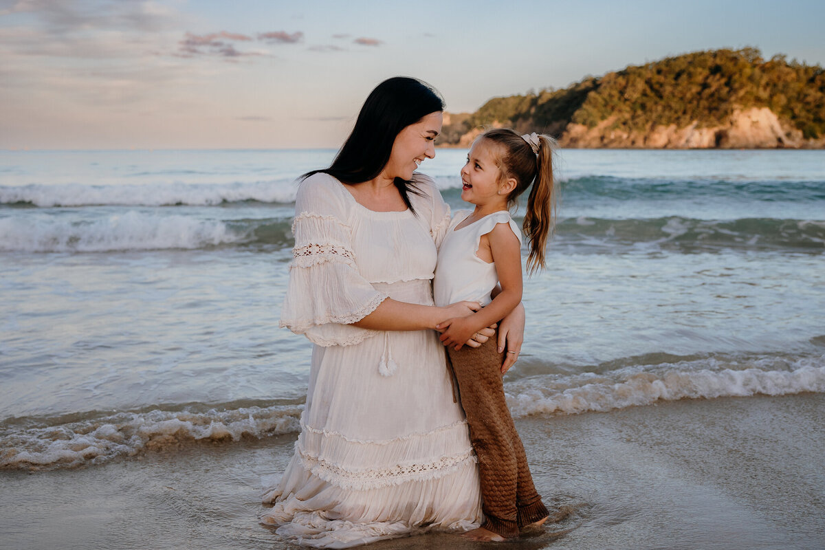 Mum with daughter in beautiful family portrait at the beach in Whangarei