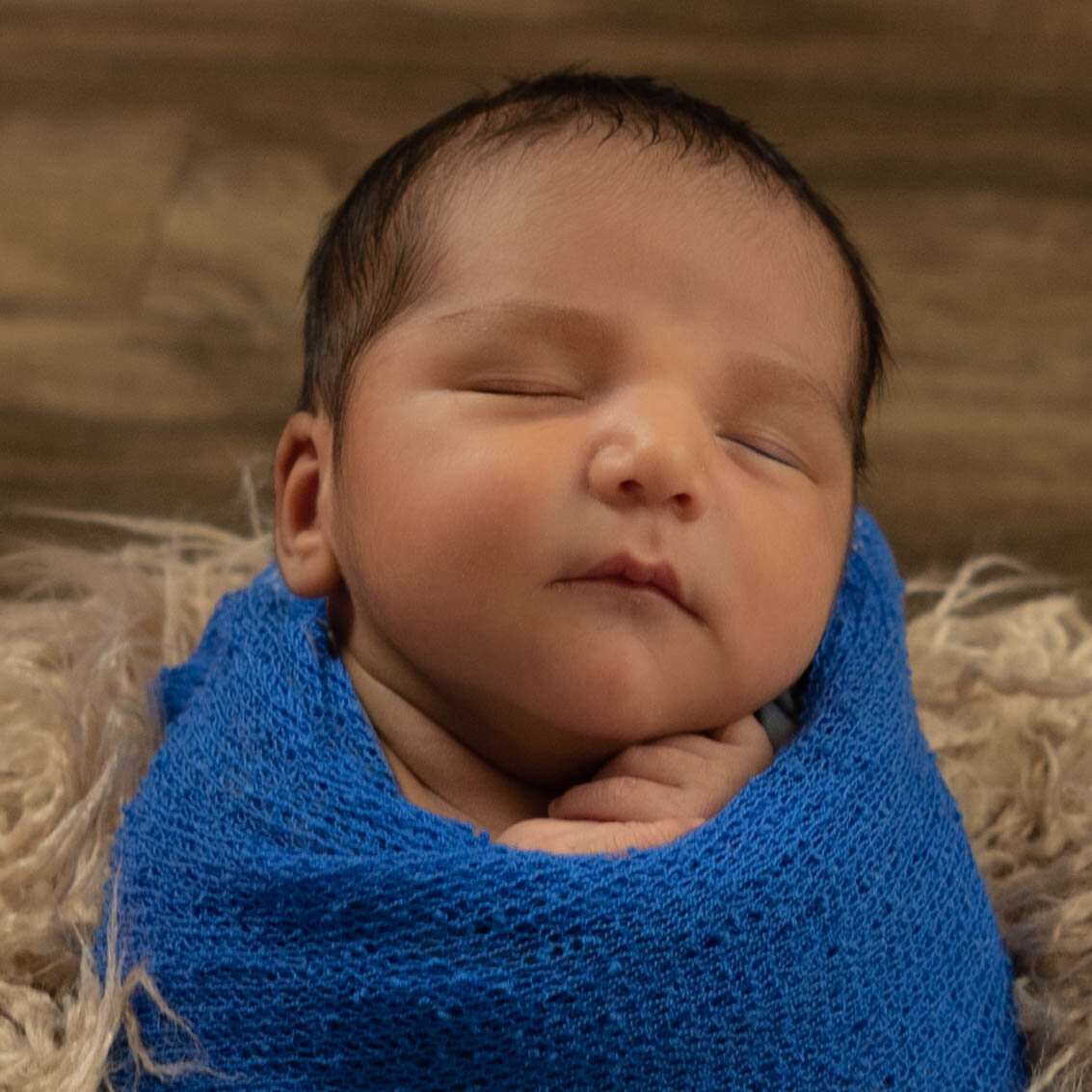 Angelic pose in blue swaddling