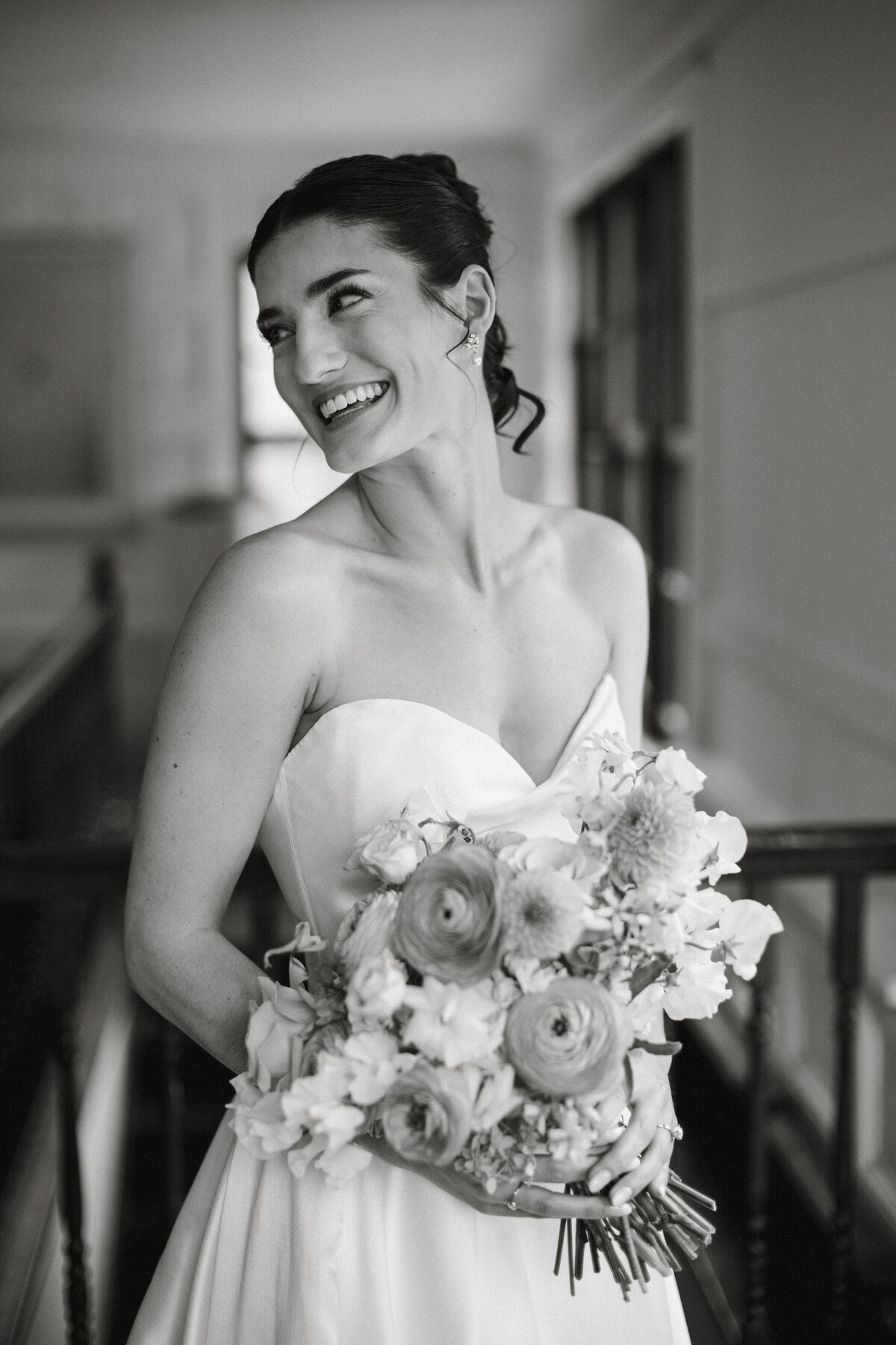 Bride looking left in a strapless wedding dress bridal portrait with a bouquet 