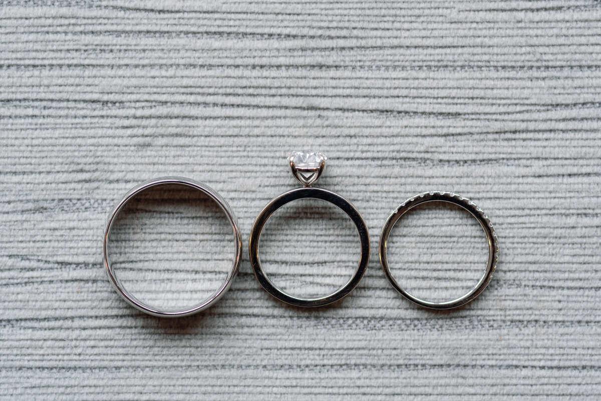 Wedding rings and engagement ring in a line by Halifax wedding photographer, Alyssa Joy Photography