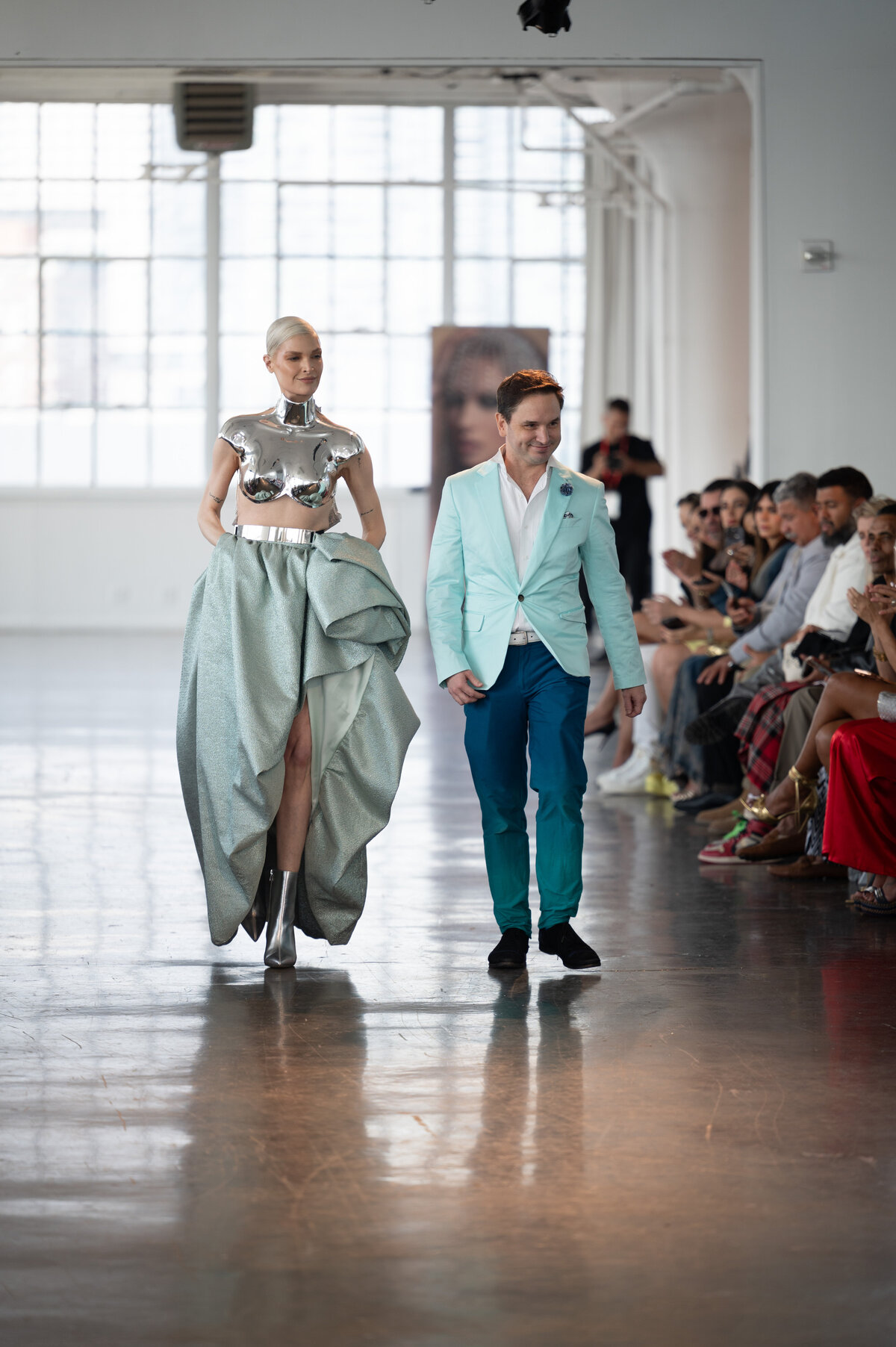 model and designer walking runway at fdla