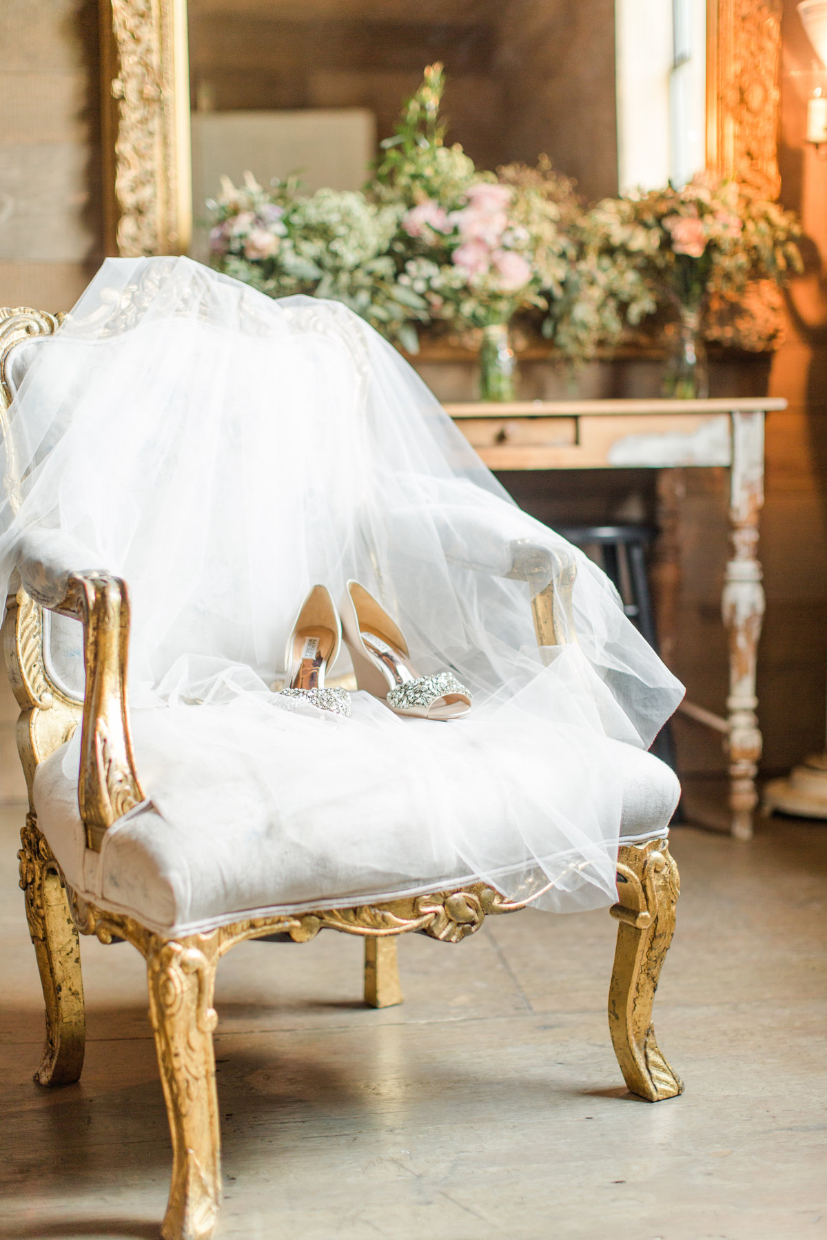 Bride's shoes and veil in chair; The Barn at Shady Lane, Birmingham, Alabama