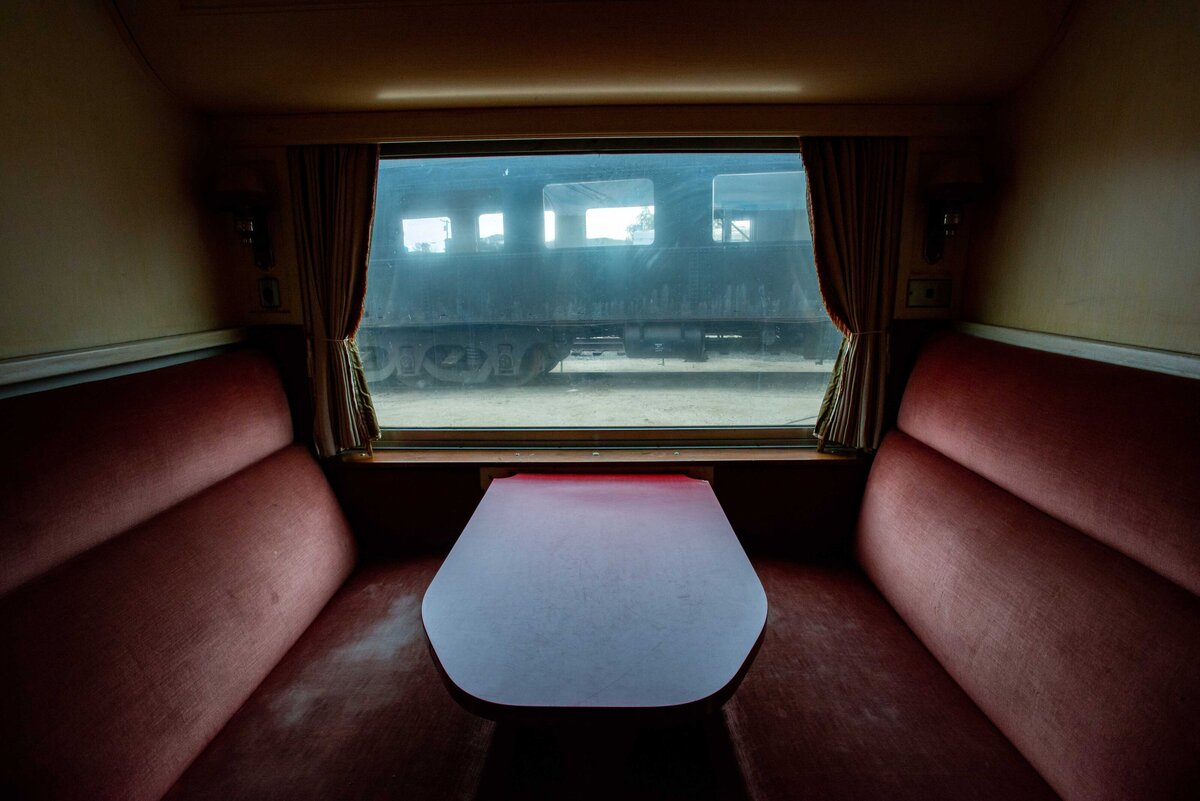Red velvet train car seat with foggy window that once transported president Rosevelt
