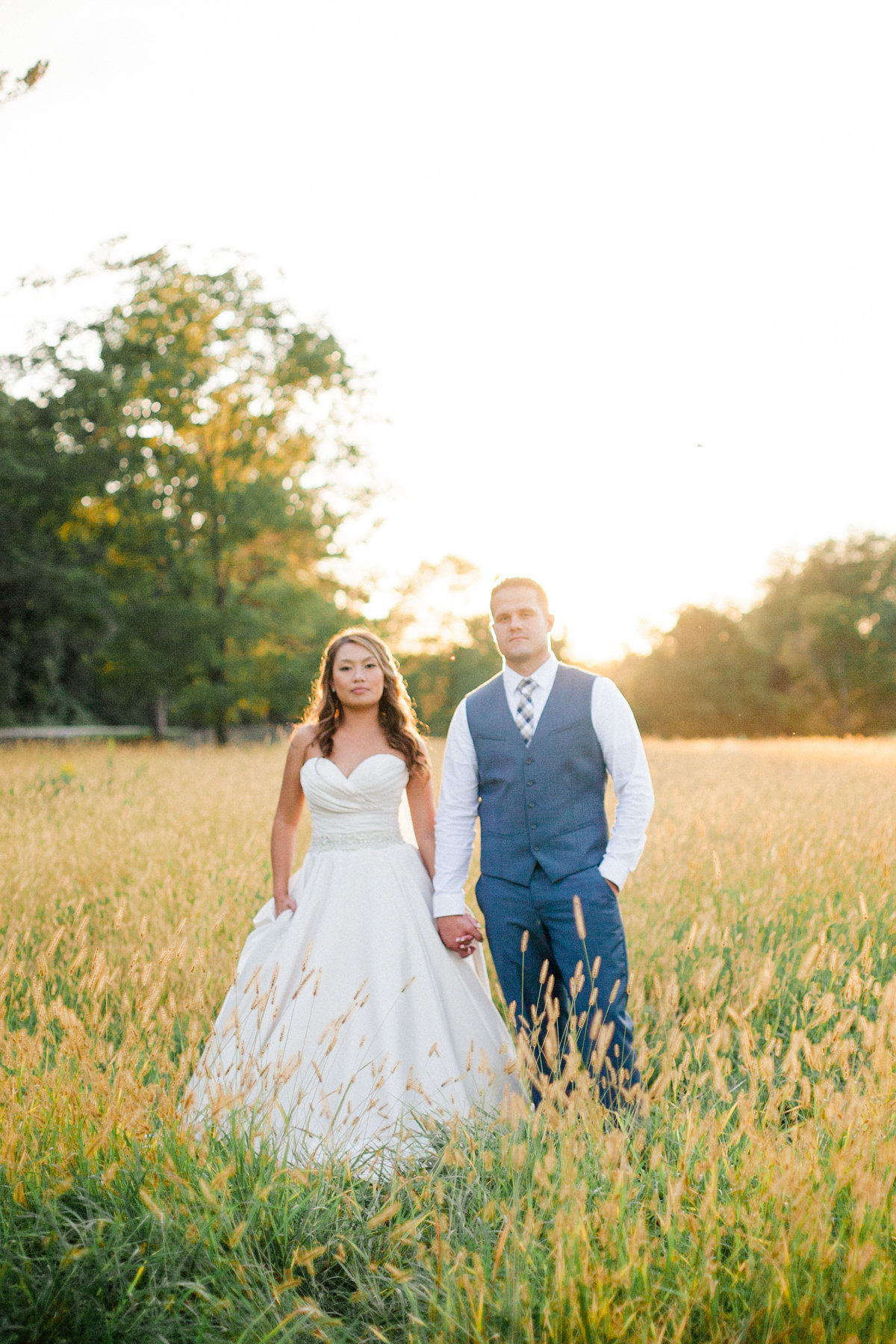 taryn christine photography wedding photographer mayowood stone barn couple stands hand in hand