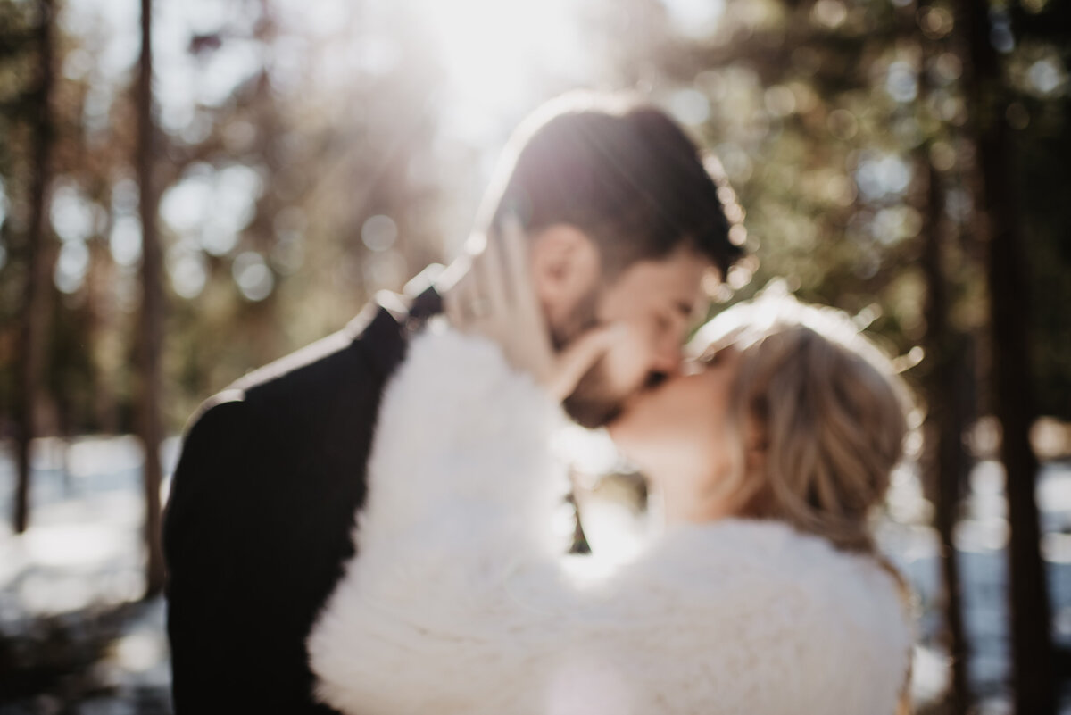 Jackson Hole Photographers capture couple kissing during bridal portraits