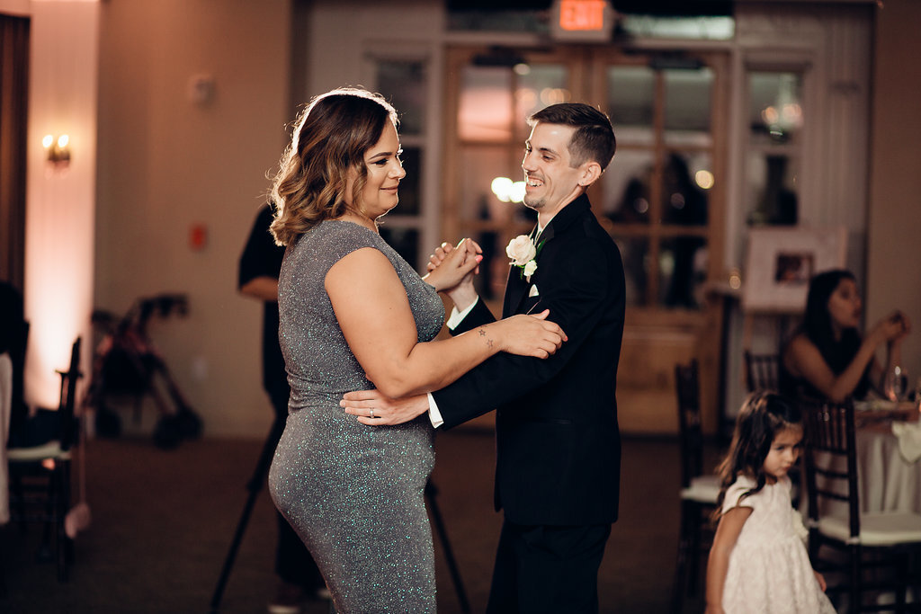 Wedding Photograph Of Groom And Woman Smiling While Dancing Los Angeles