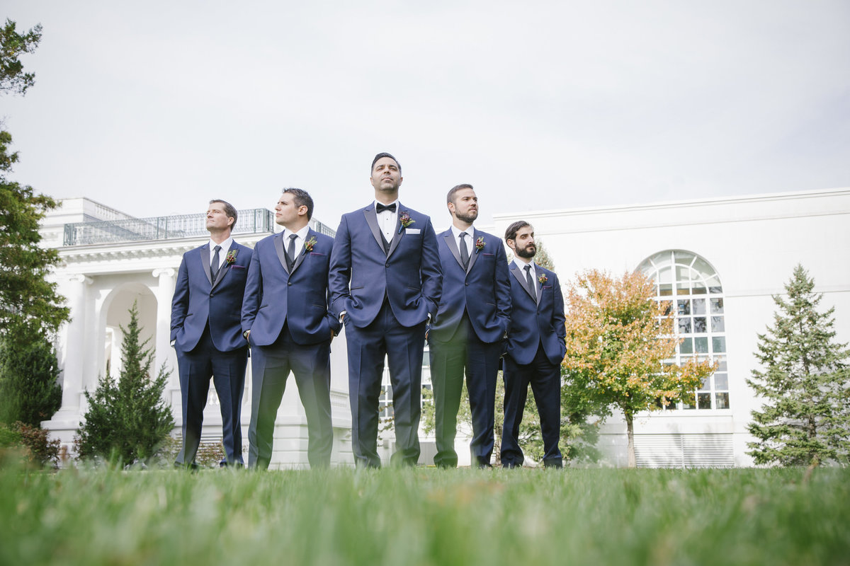 groomsmen standing in front of monmouth university