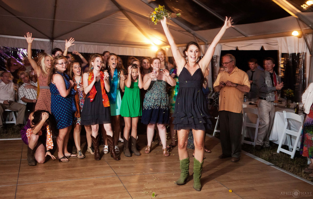 Bouquet Toss at a Fun Steamboat Springs Wedding in Colorado