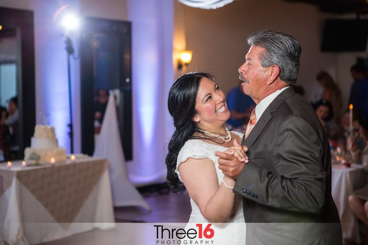 Bride dances with her father at her wedding reception