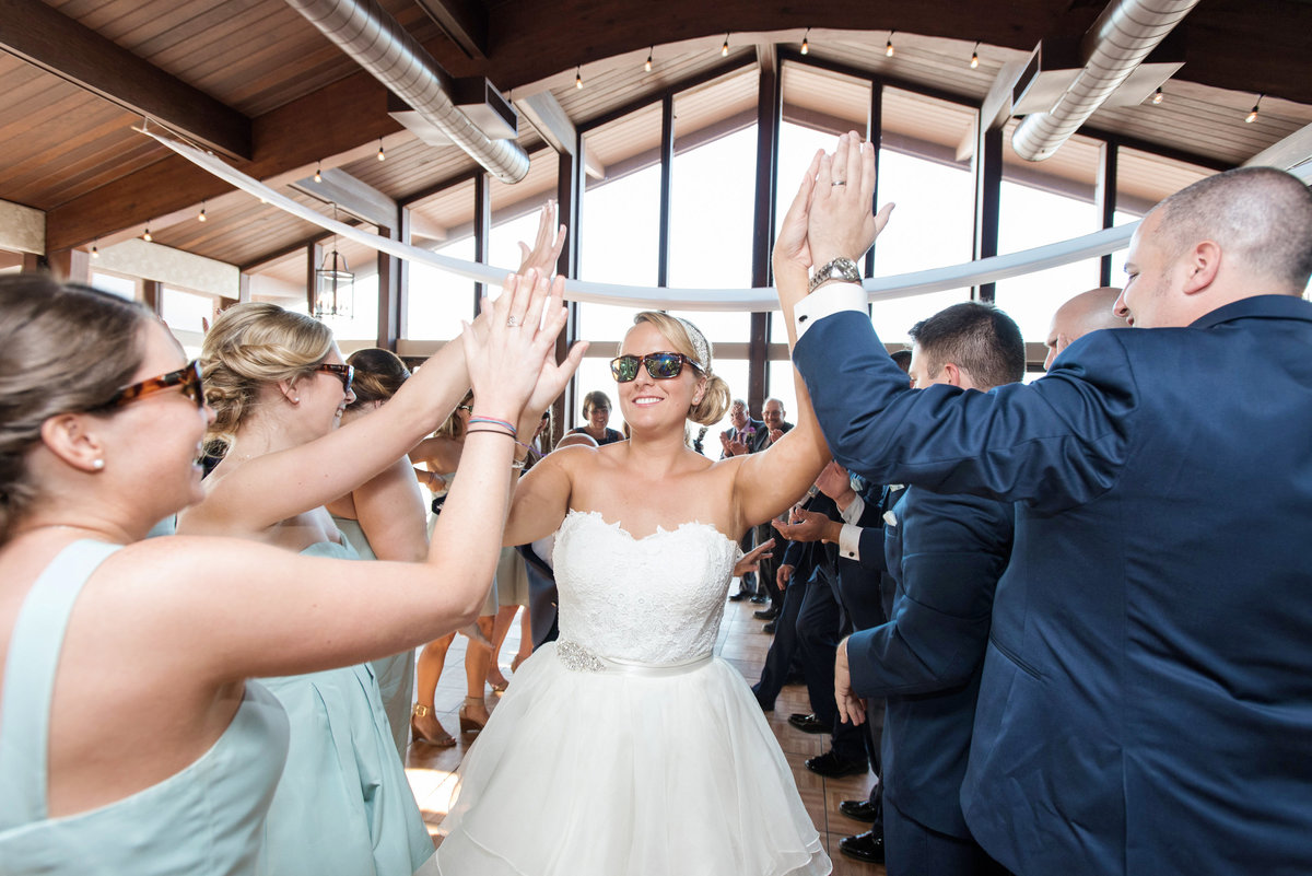 bride and bridal party dancing with sunglasses during wedding reception at Pavilion at Sunken Meadow
