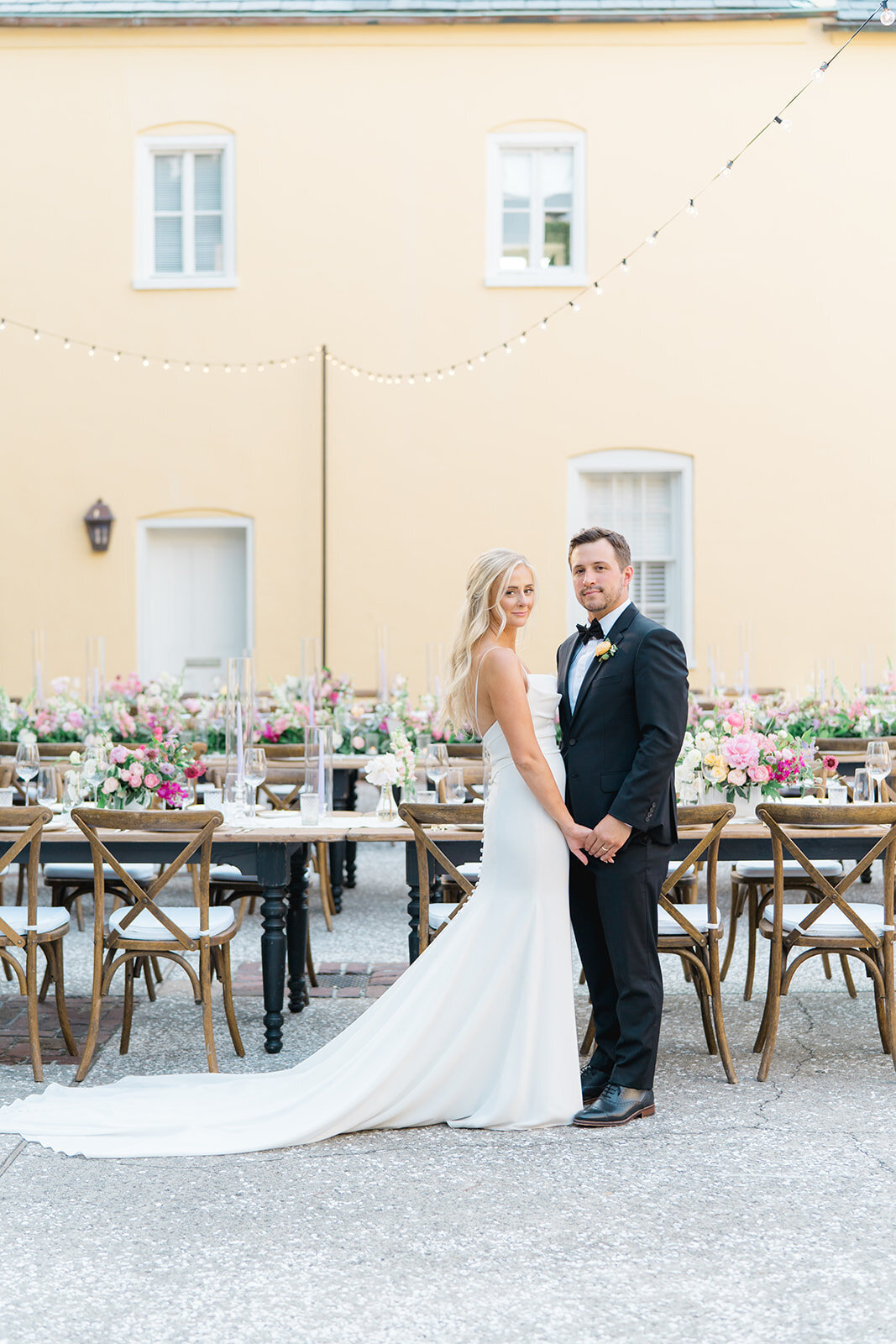 Perfect lighting wedding day portraits at open air wedding reception. Yellow walls at William Aiken House.