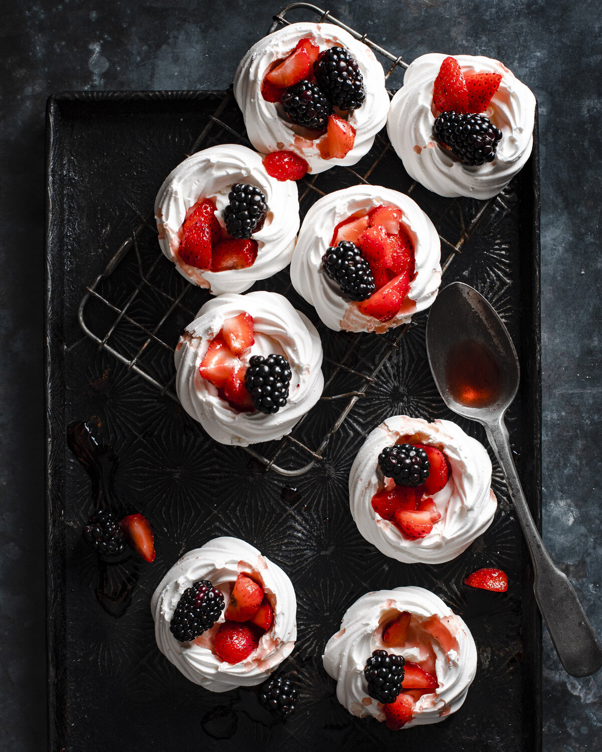 Overhead image of berry meringues with berries on top.
